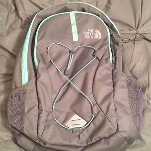 Grey and teal north face backpack